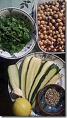 Ingredients for hummus (clockwise from top - chickpeas and aduki beans, courgette, spices, lemon, garlic and coriander leaf)